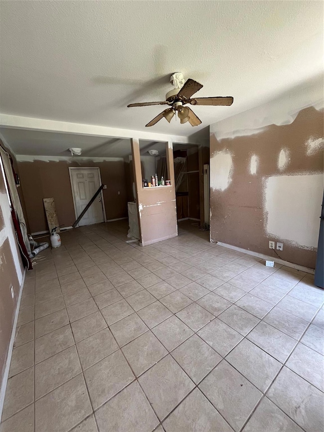 Unfurnished room with light tile patterned floors,