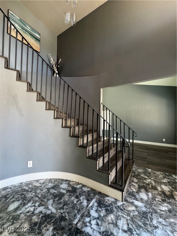 Stairs featuring baseboards