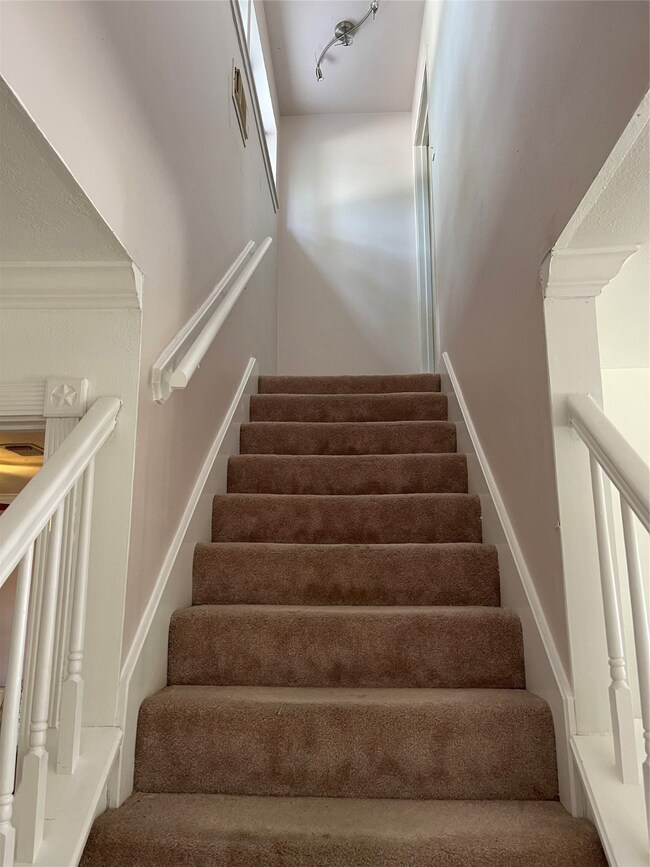 Stairs off breakfast room to main bedroom on 2nd f