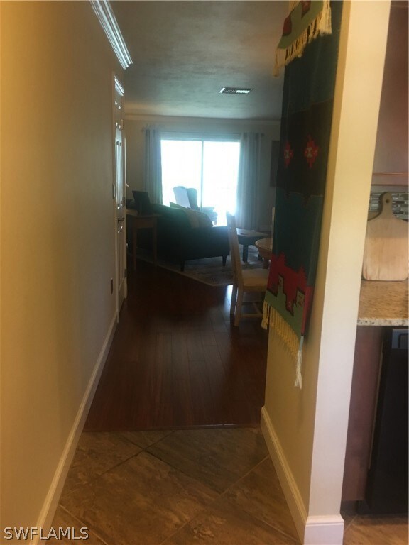 Hallway into living/dining area. Great flooring.