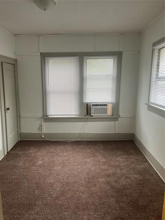 Carpeted empty room featuring cooling unit