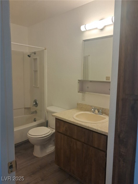 Bathroom toilet, vanity, and shower / bath combina