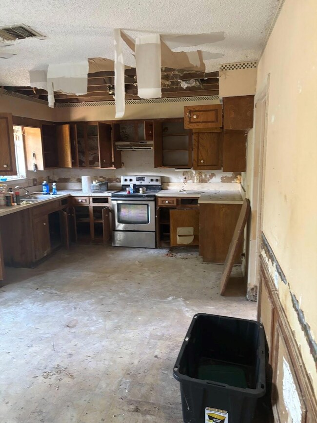 Kitchen with stainless steel range with electric s