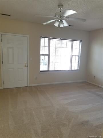 Living room has natural light and overlooks the ba