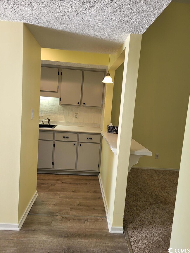 The kitchen is to your left as you enter.