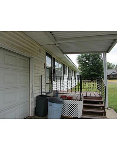 Facade/Exterior Front. Home has vinyl siding, atta