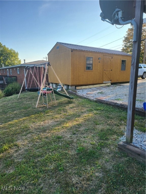 View of green lawn with a playground