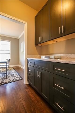 Entertain guests with this butler's pantry, hidden off to the side.