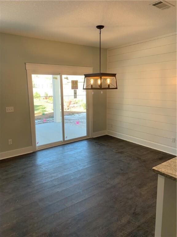 Dining Nook features shiplap accent wall and acces