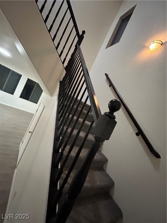 Stairway with a towering ceiling