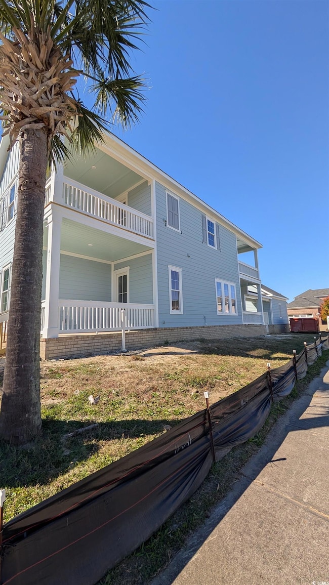 View of home's exterior with a balcony
