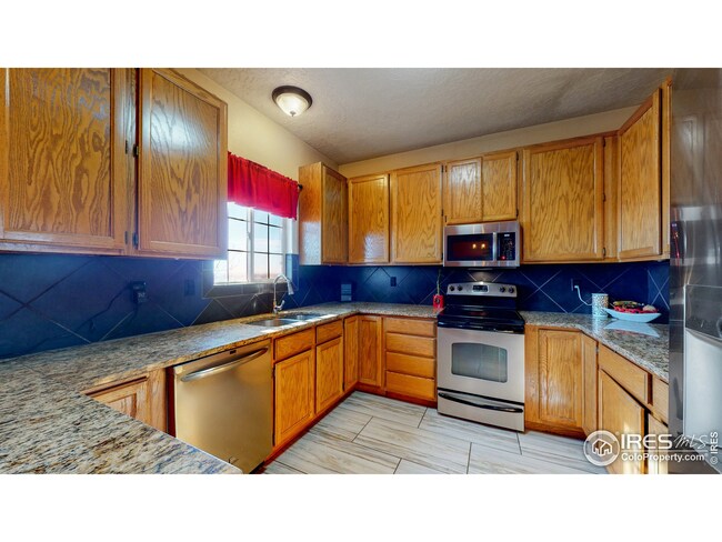 Remodeled Kitchen with Tile Floors, Granite Countertops, Full Back Splash and New Appliances!