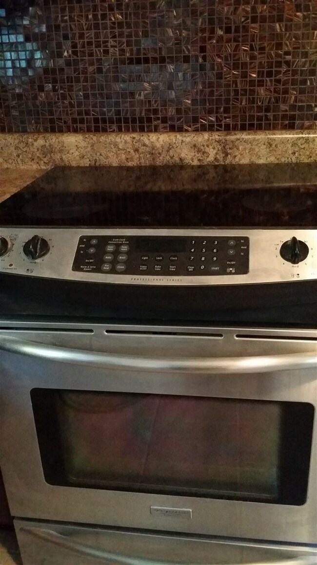 Stainless Steel Appliances and beautiful custom ba