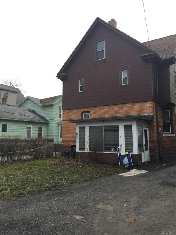 Enclosed patio, partially fenced in backyard