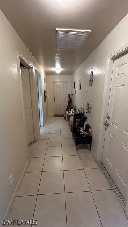 Hall with light tile floors