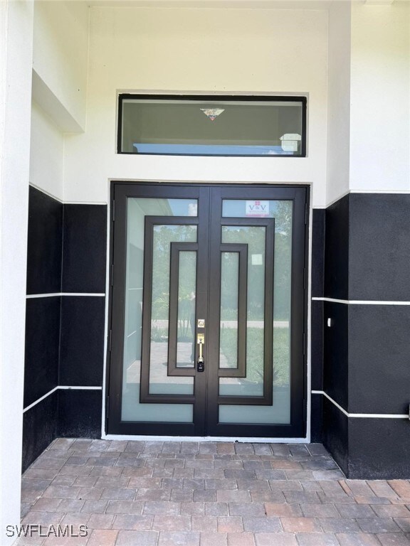 Entrance to property featuring french doors and st