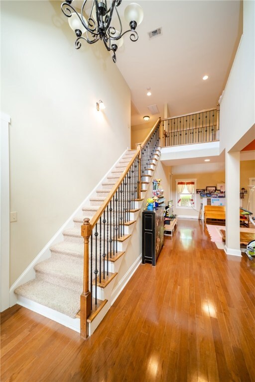 Two-story foyer and gleaming hardwoods