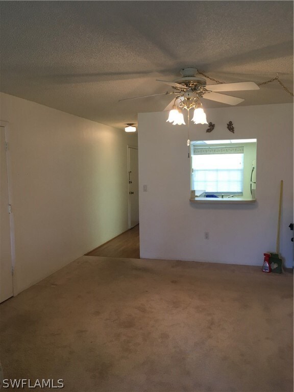 dining area looking to kitchen pass thru