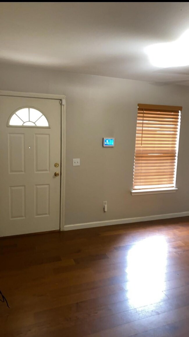 Foyer featuring dark wood-type flooring