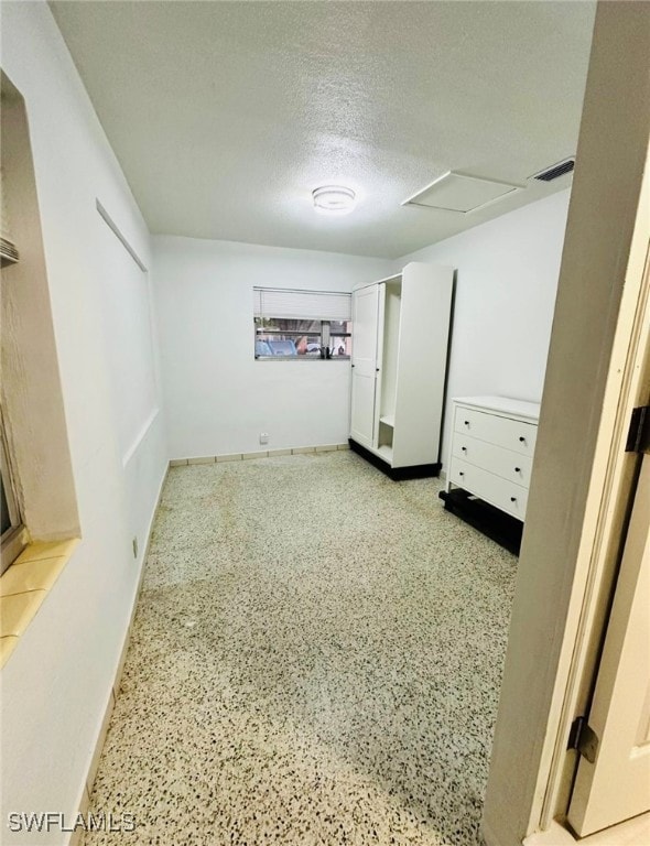Basement with a textured ceiling