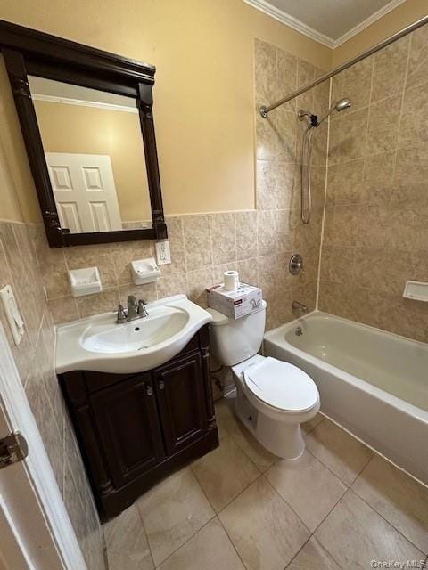 Bathroom with tile walls, crown molding, vanity, shower / tub combination, and light tile patterned flooring