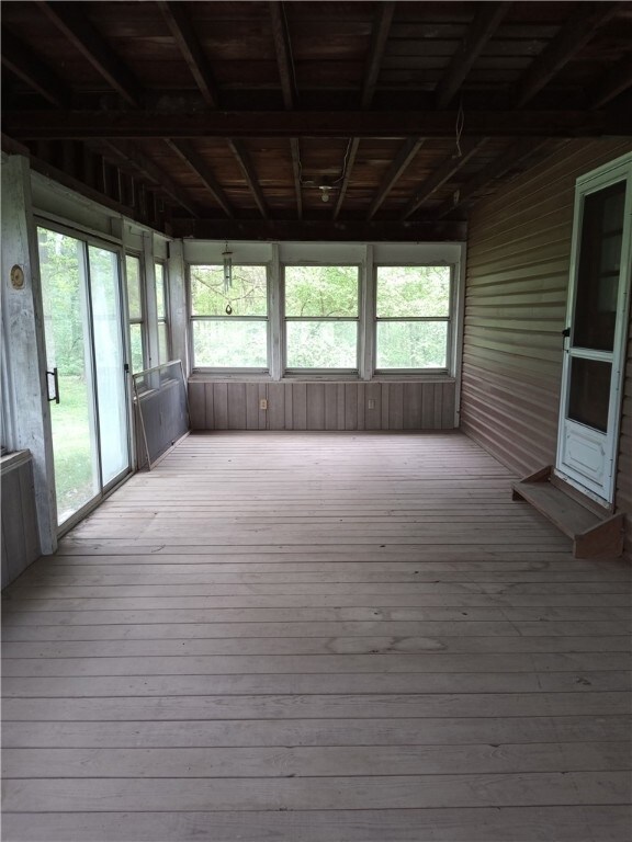 Enclosed porch facing woods. Size 28X12