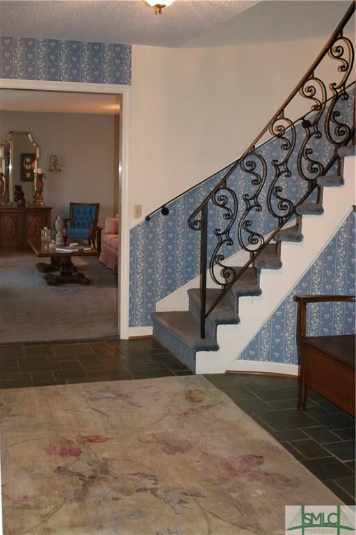 Foyer wallpaper being professionally removed begin