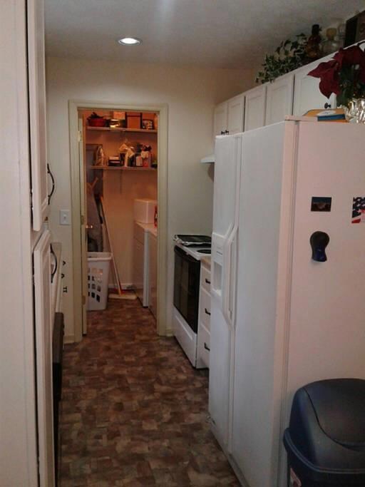 View of the LAUNDRY ROOM From Kitchen.  Full Size Washer & Dryer Stay 