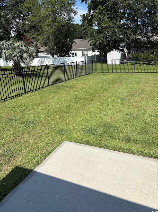 View of yard with a patio area