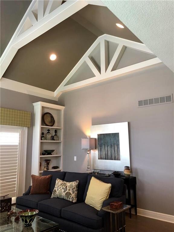 Living room vaulted ceiling with cathedral beams