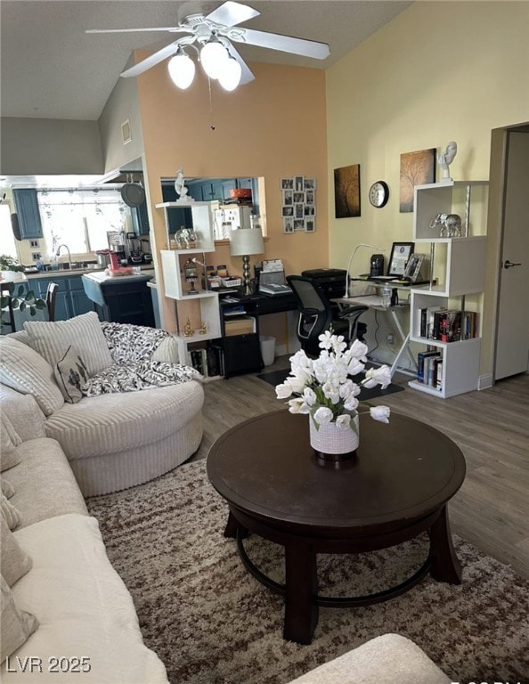 Living room featuring visible vents, vaulted ceili