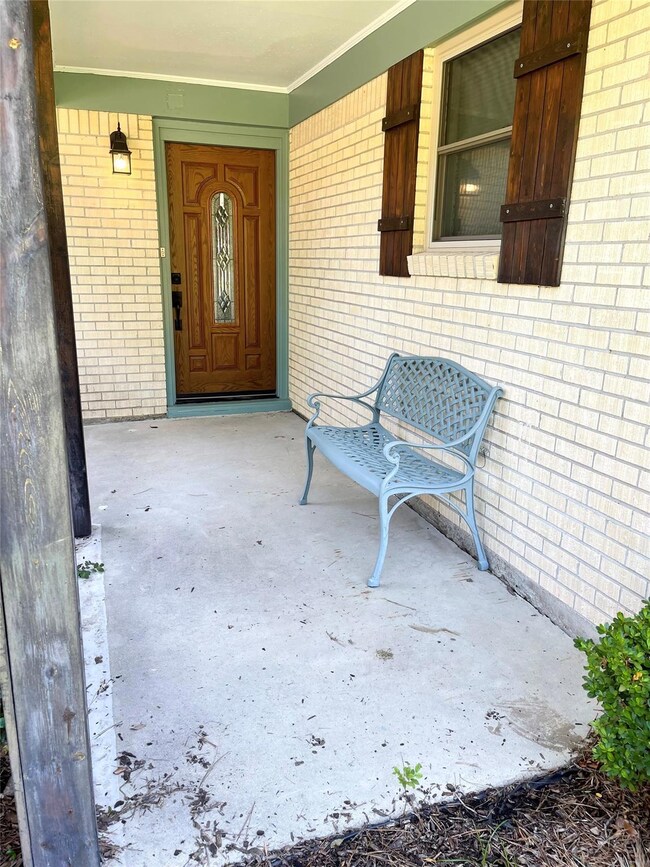 Entrance to property featuring a porch