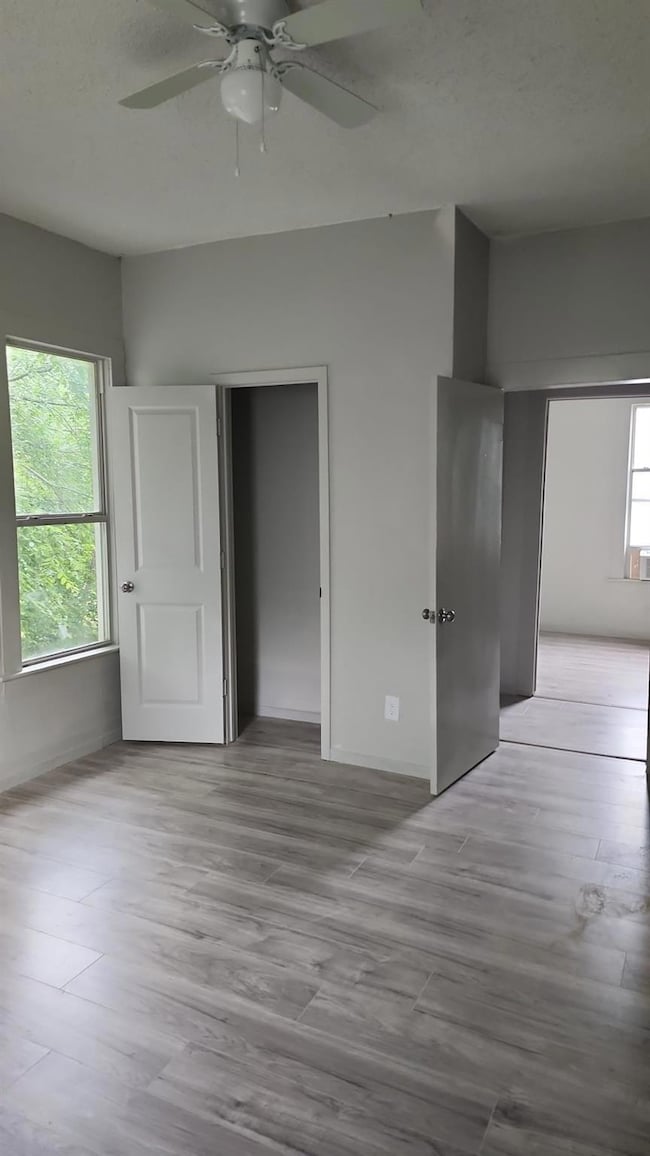 Unfurnished bedroom with light wood-type flooring,