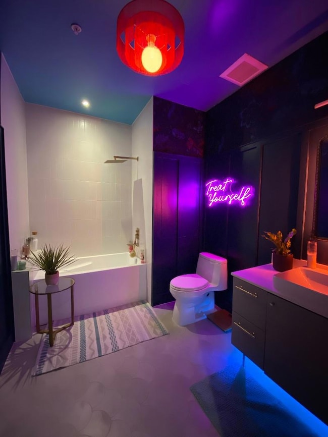 Full bathroom featuring vanity and shower / washtub combination