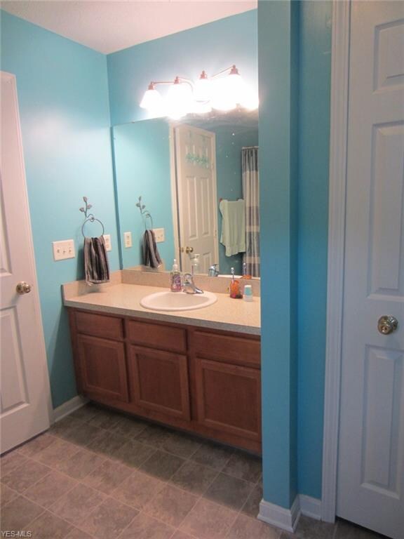 Master bath with tub/shower and closet.