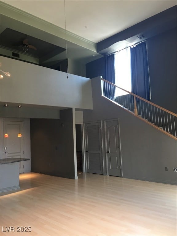 Unfurnished living room with wood finished floors,