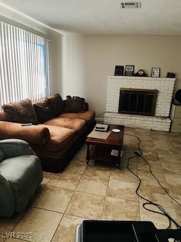 Living room with a brick fireplace and a textured