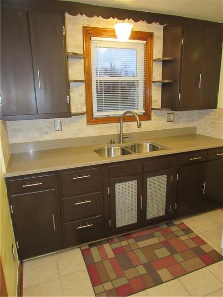 Kitchen with new quartz counter tops with neutral 