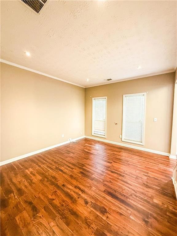 Staircase with a chandelier, wood finished floors, a towering ceiling, and ornamental molding
