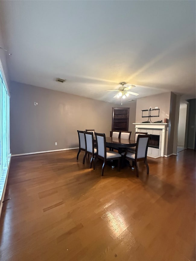 Walking forward into the family room, with a fireplace and custom cabinet, great for photos.