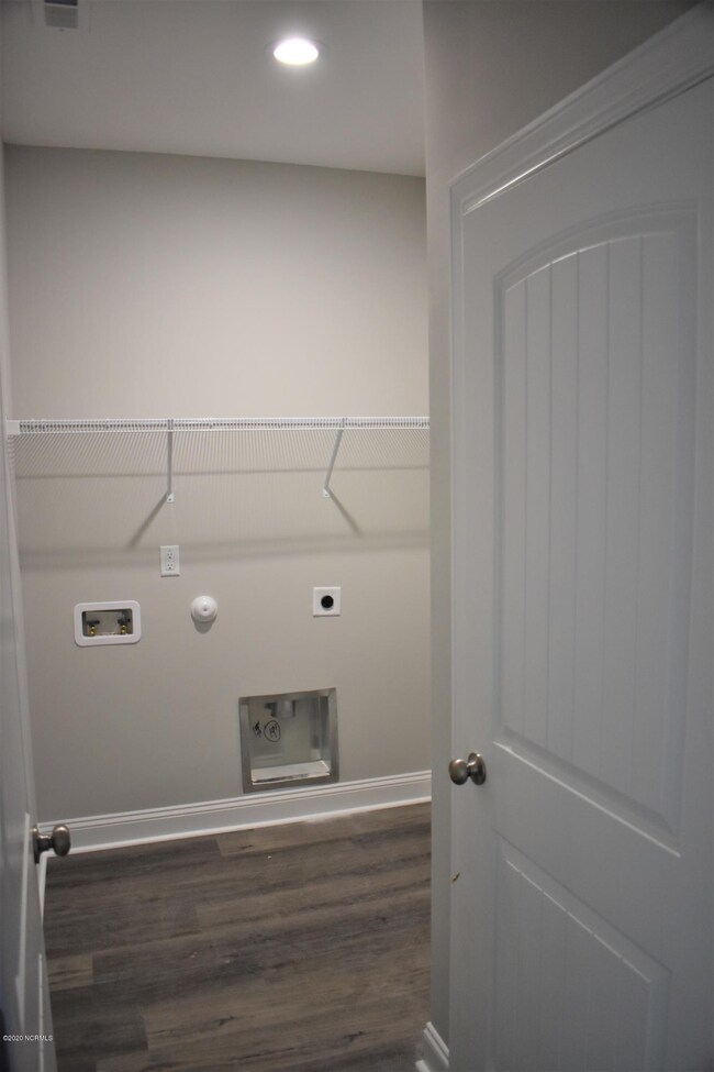 laundry room with lien closet