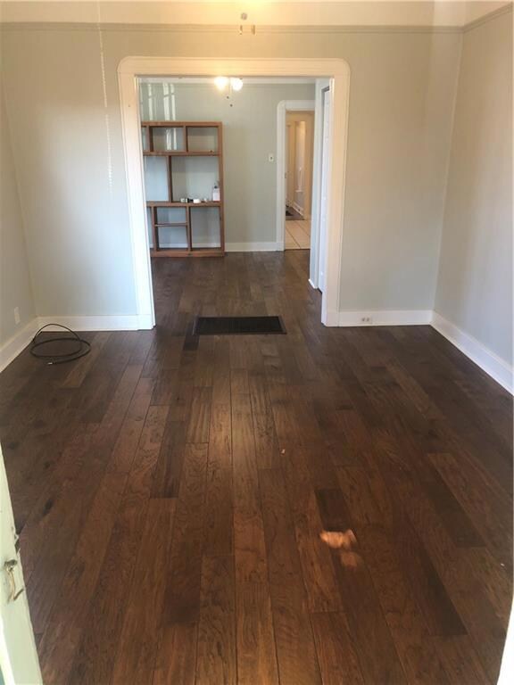 Walnut stained wood laminate flooring in Living Ro