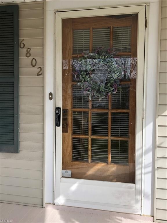 Welcome again!  Solid wood door adds to the charm and beauty of this home!