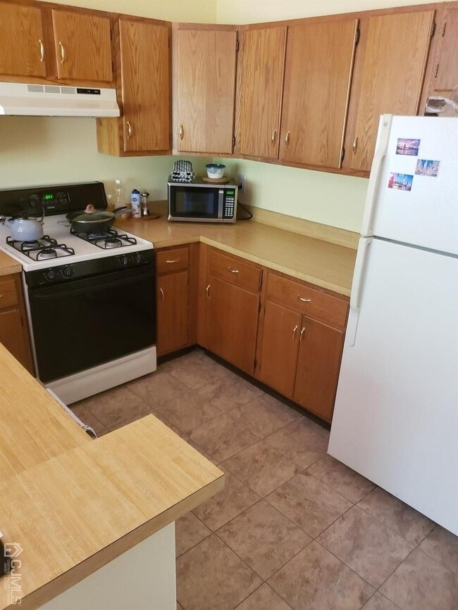 Newer kitchen flooring and a newer dishwasher in t
