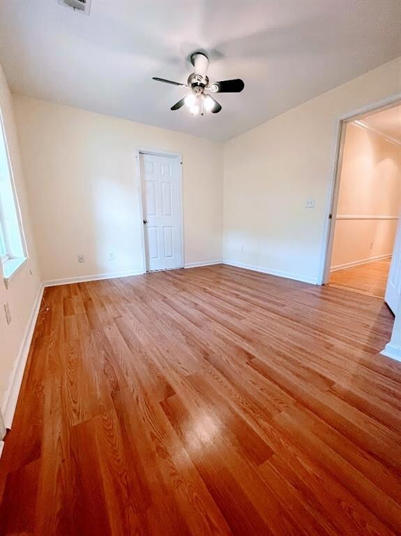 Spare room featuring baseboards, ceiling fan, and 