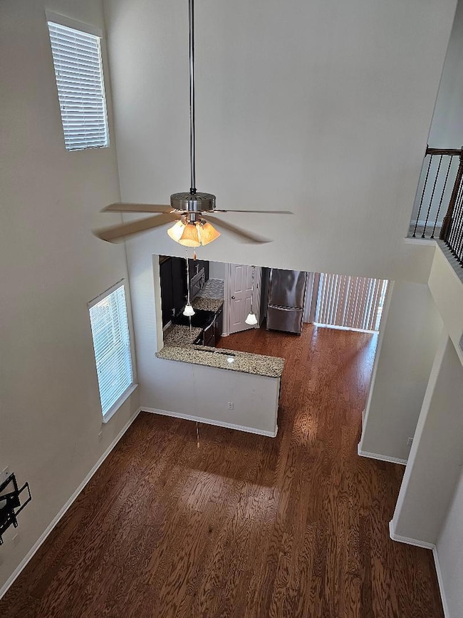 Unfurnished living room with wood finished floors