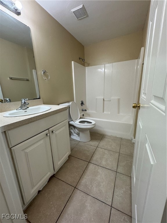 Bathroom with vanity, washtub / shower combination, and light tile patterned flooring