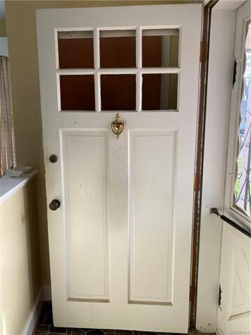 Love this door! Coat closet is behind it.