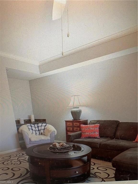 Living area with tile patterned floors and baseboards