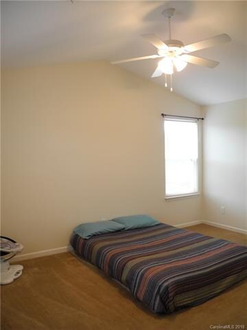 Master bedroom with vaulted ceilings